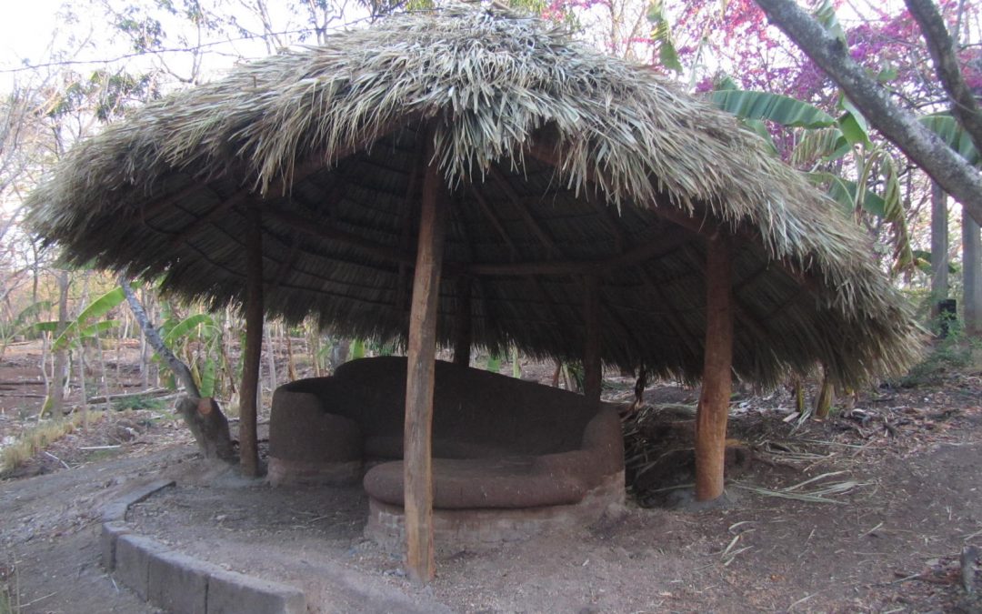 cob bench with thatch roof
